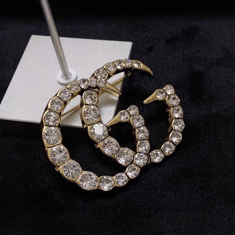 Gvc*1 brooches